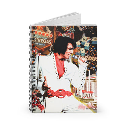 A spiral-bound notebook featuring a colorful collage-style cover print of Elvis Presley in a white suit with a red vest, set against a Las Vegas-themed background with casino signs and buildings.